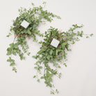 Light pink flower swag with green foliage
