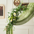 wedding‑backdrop‑corner‑green‑white‑floral‑swags
