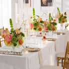 lush‑summer‑faux‑table‑flowers‑indoor‑wedding‑ceremony‑shot