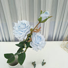 Pastel blue silk rose with green leaves