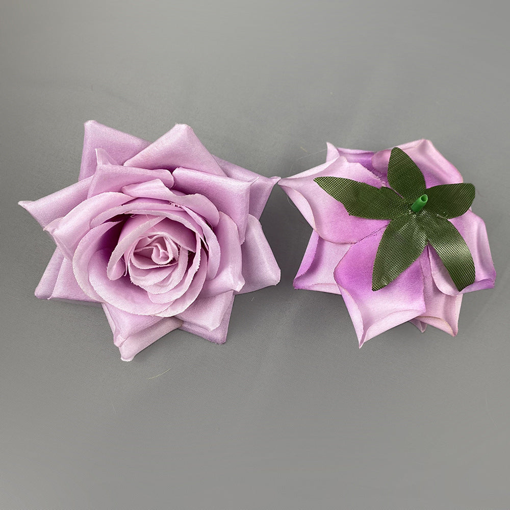 Decorative silk rose flower heads wedding arrangement