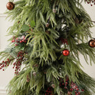 christmas table centerpiece with mixed pine, eucalyptus and red berries