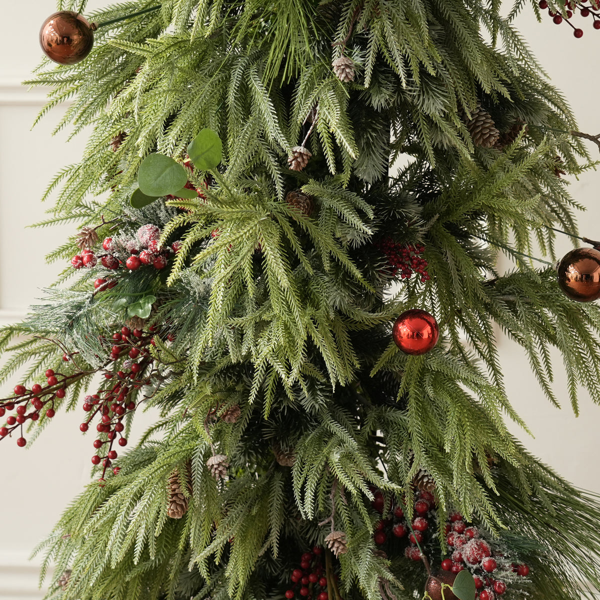 christmas table centerpiece with mixed pine, eucalyptus and red berries