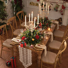 Faux red rose, pine and eucalyptus floral swag with hanging star bell and big red bow