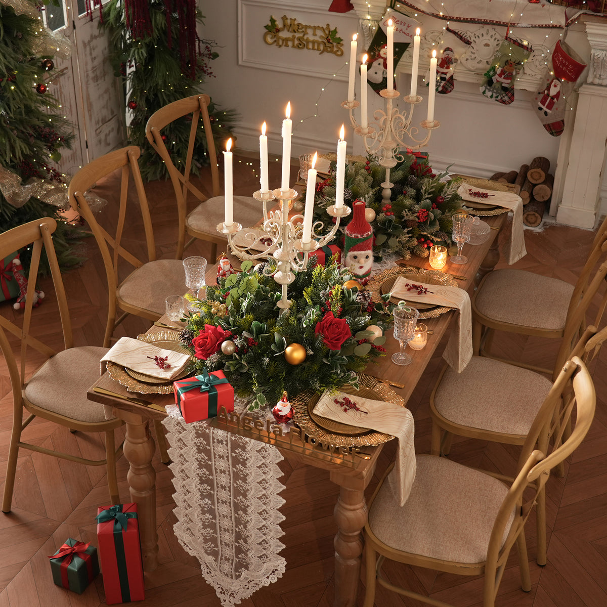 Faux red rose, pine and eucalyptus floral swag with hanging star bell and big red bow
