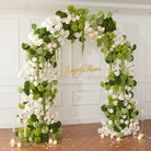 green vine hanging white green wedding arch florals