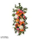 Bright garden style sunset floral arch for outdoor ceremony