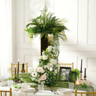 Tall gold stand flower arrangement for indoor reception
