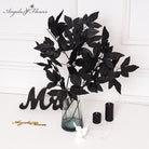Texture photo of black silk flower petals and leaves