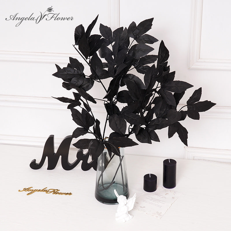 Texture photo of black silk flower petals and leaves