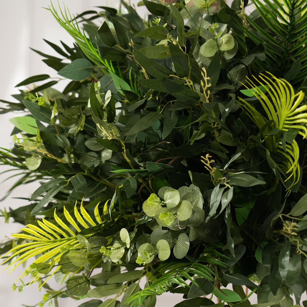 Artificial olive leaf foliage table arrangement for modern luxury wedding reception