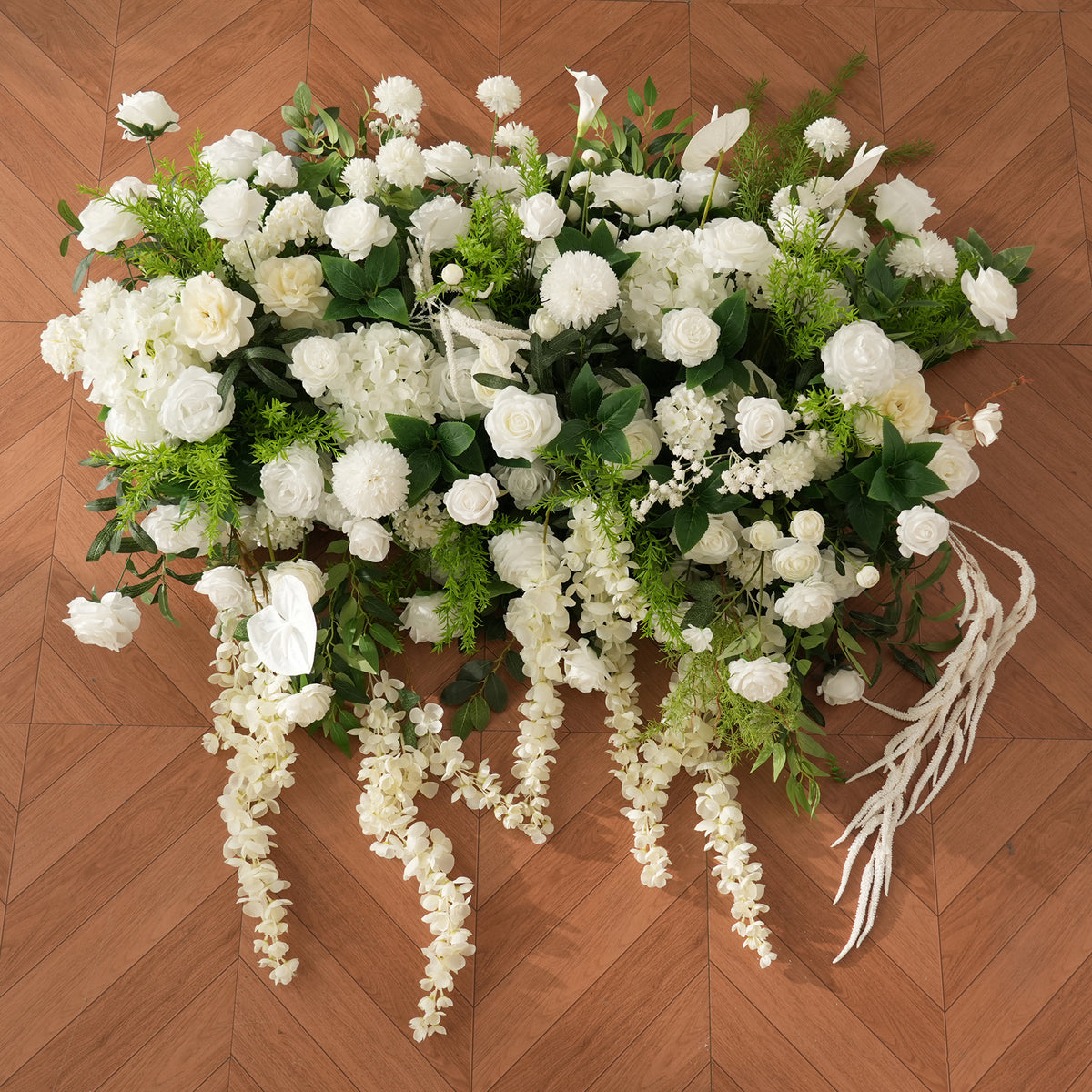 Fine sprengeri green foliage mixed with white blooms on arch