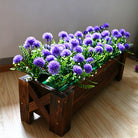 faux ball thistle with green foliage