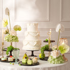 Light green hydrangea paired with blush cream rose table arrangement