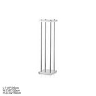 Silver metal pillar stands with soft window shadow on neutral beige wall