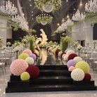 Rose sphere placed on tall white pedestal for ceremony