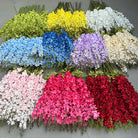 magenta faux delphinium stem event table decor