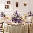 Purple artificial flower table arrangement for wedding and dinner event decor