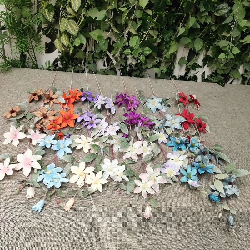 mixed‑tone-fake-clematis-floral-arrangement
