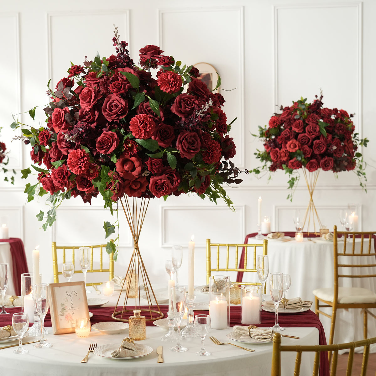Elegant cascading fake floral table centerpiece with burgundy roses dahlia ivy, ideal for wedding and formal party decor