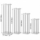 Tall metal pillar pedestal stands used as wedding aisle flower decor holders