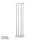 Side by side gold and silver pillar stands decorated with white and pink rose balls