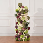 Hydrangea mixed with leafy green foliage for full volume