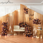 Moody fall tone plum mauve rose arrangement for wedding ceremony background