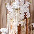 indoor backdrop silk flower installation neutral earth tone wedding flowers