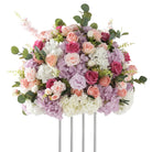 Reusable faux fuchsia peach rose table arrangement for banquet events