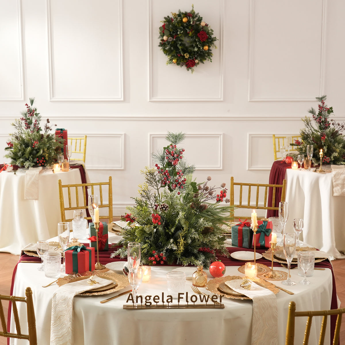 Luxury Christmas dining table styling with pine berry centerpieces