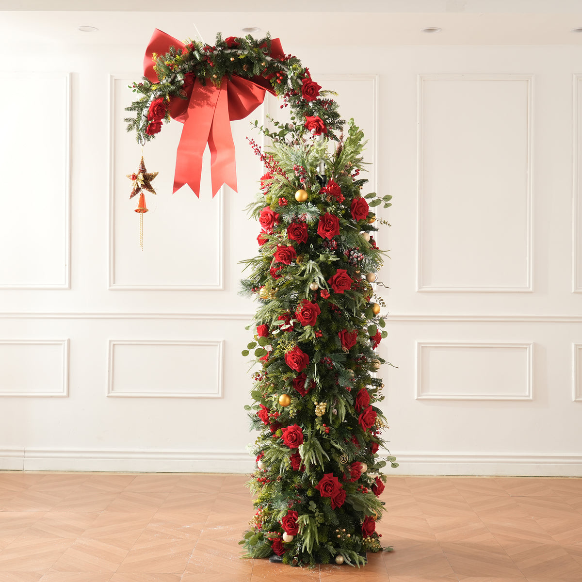 Small christmas corner greenery swags with red roses, pine cones and red berries for decoration