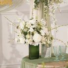 Wedding reception table flower arrangement with green foliage