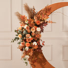 Autumn harvest silk floral arrangement for wedding backdrop setup