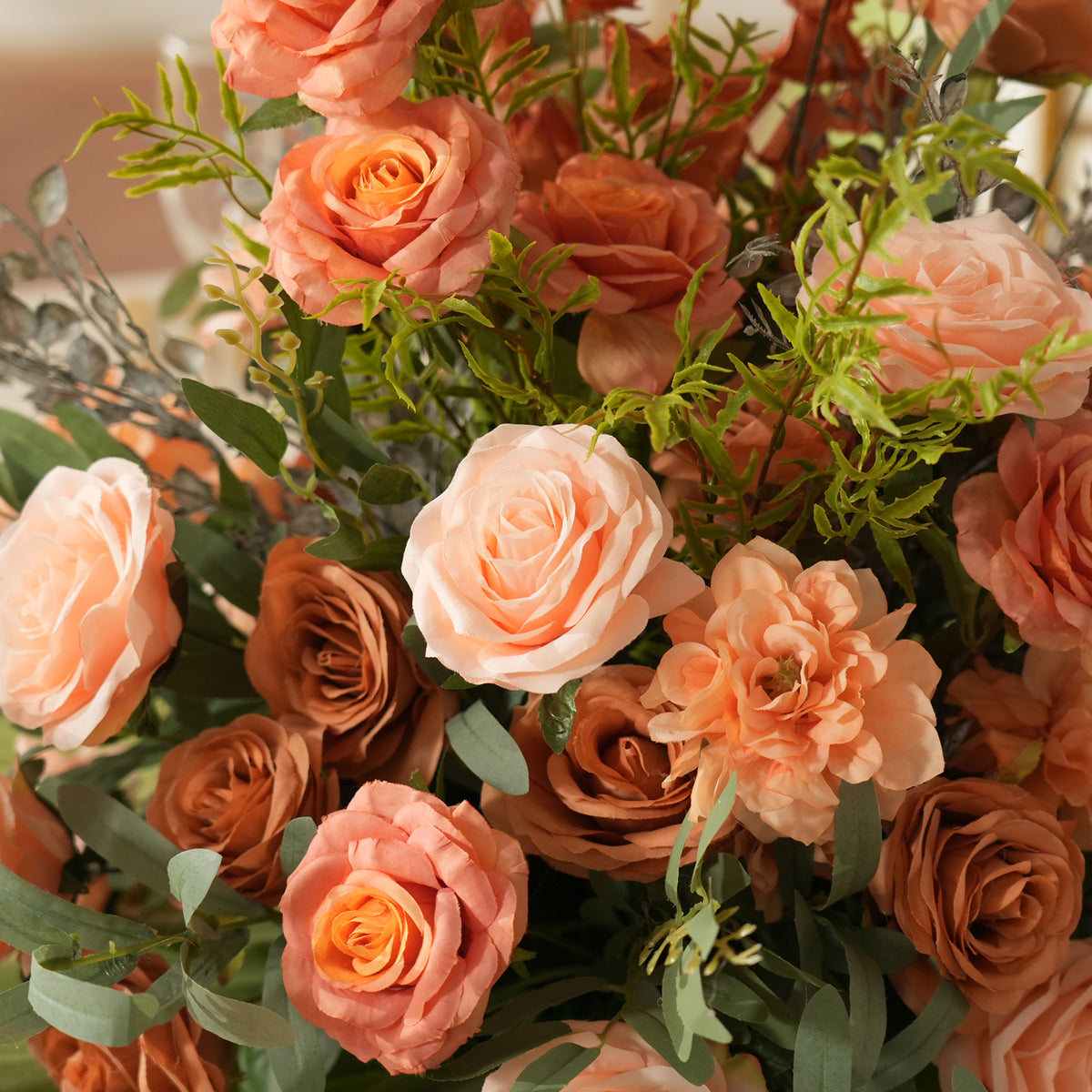 Product photo showing matching pair of terracotta peach floral table centerpieces
