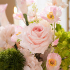 Gentle pink and green mixed artificial flower centerpiece for wedding events