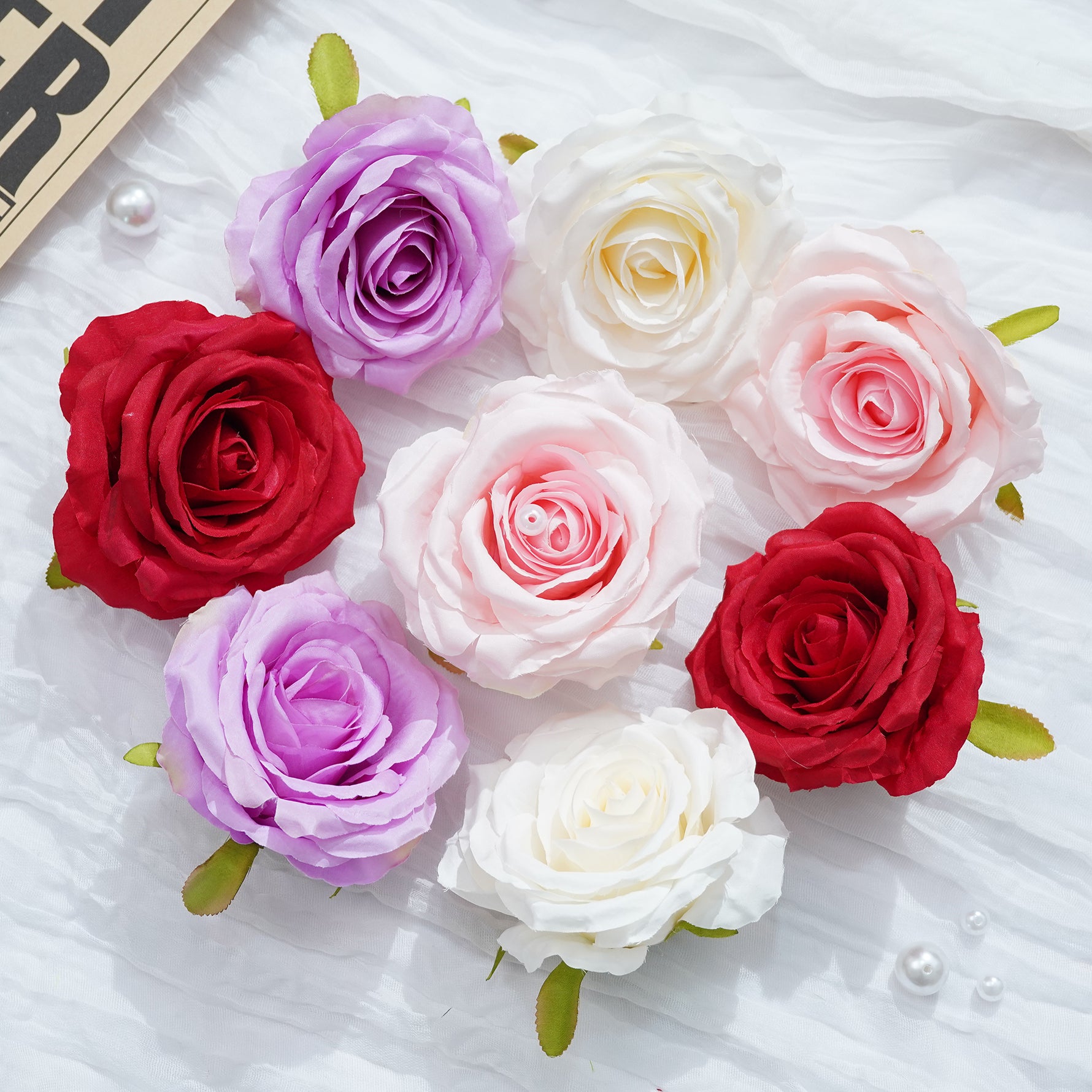 Realistic faux rose blooms with soft petals in red white pink and blue