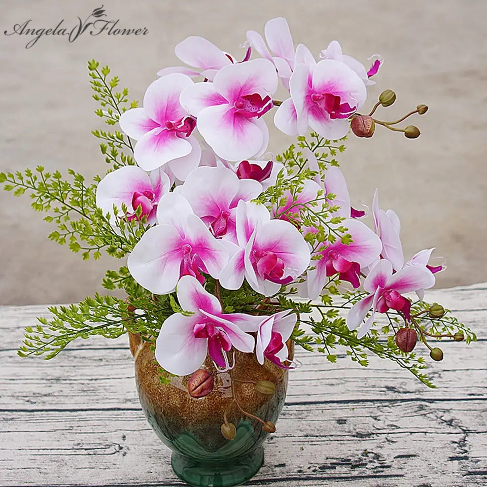 Artificial white pink phalaenopsis orchid flower arrangement in glass vase