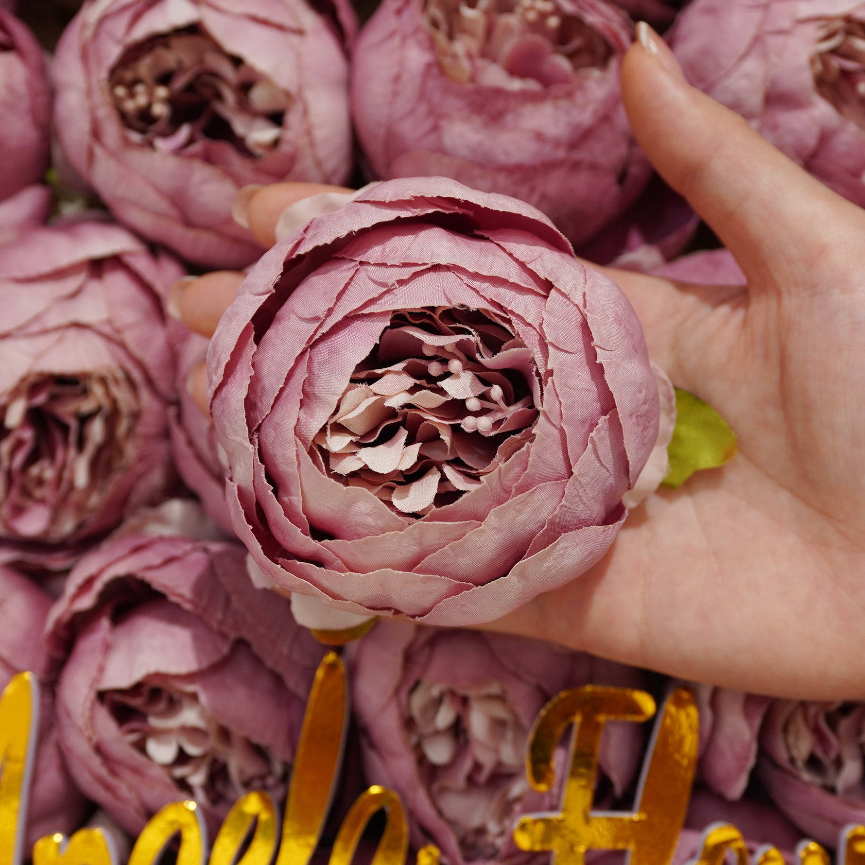 Vibrant fuchsia faux ranunculus decor blooms