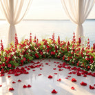 Elegant Crimson Rose Aisle Decoration with Natural Green Leaves