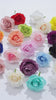 Assorted silk rose blooms in multiple colors for craft projects