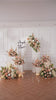 dusty apricot artificial flower install for photo backdrop