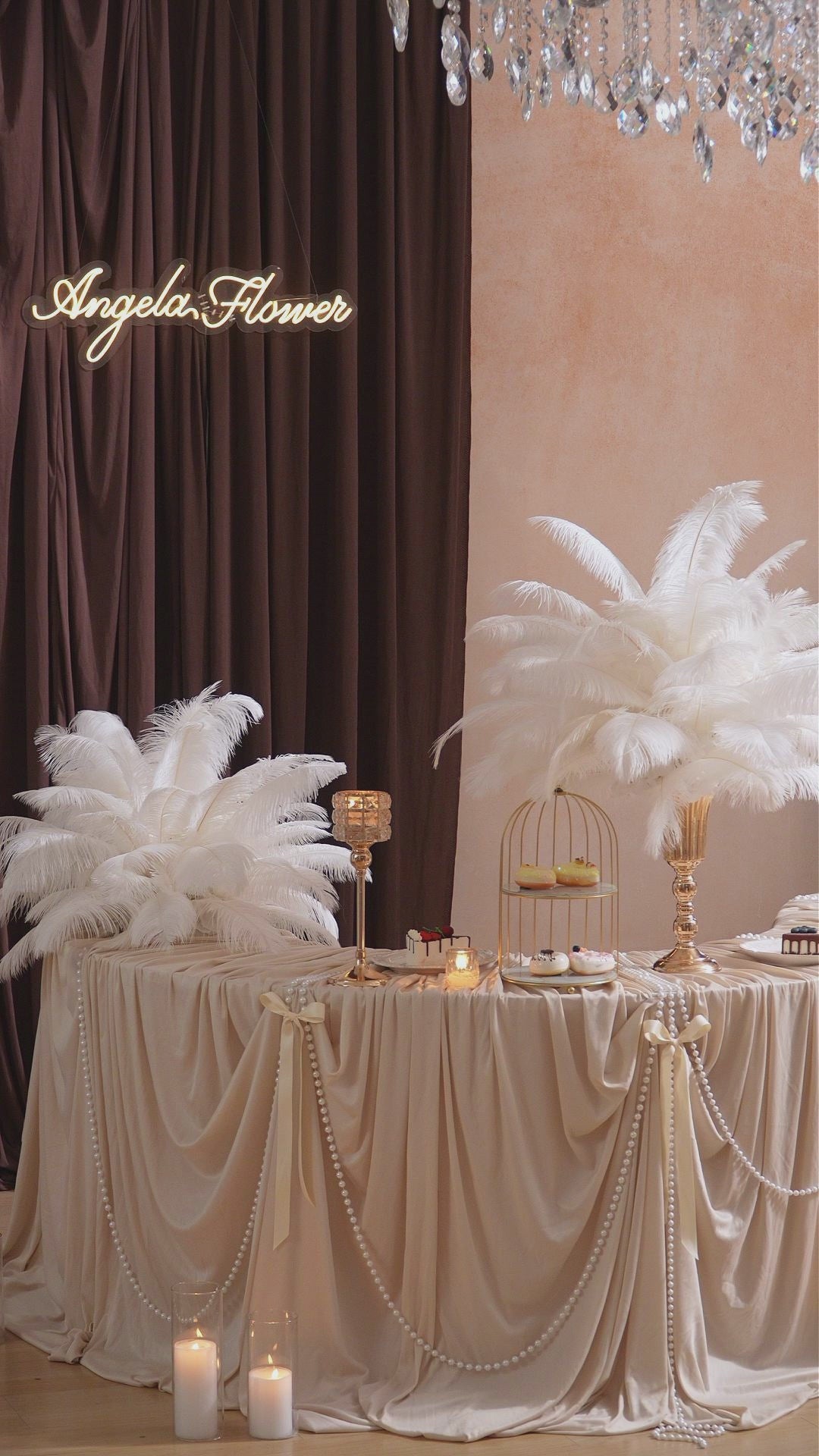 Wedding table centerpiece with natural white ostrich plumes