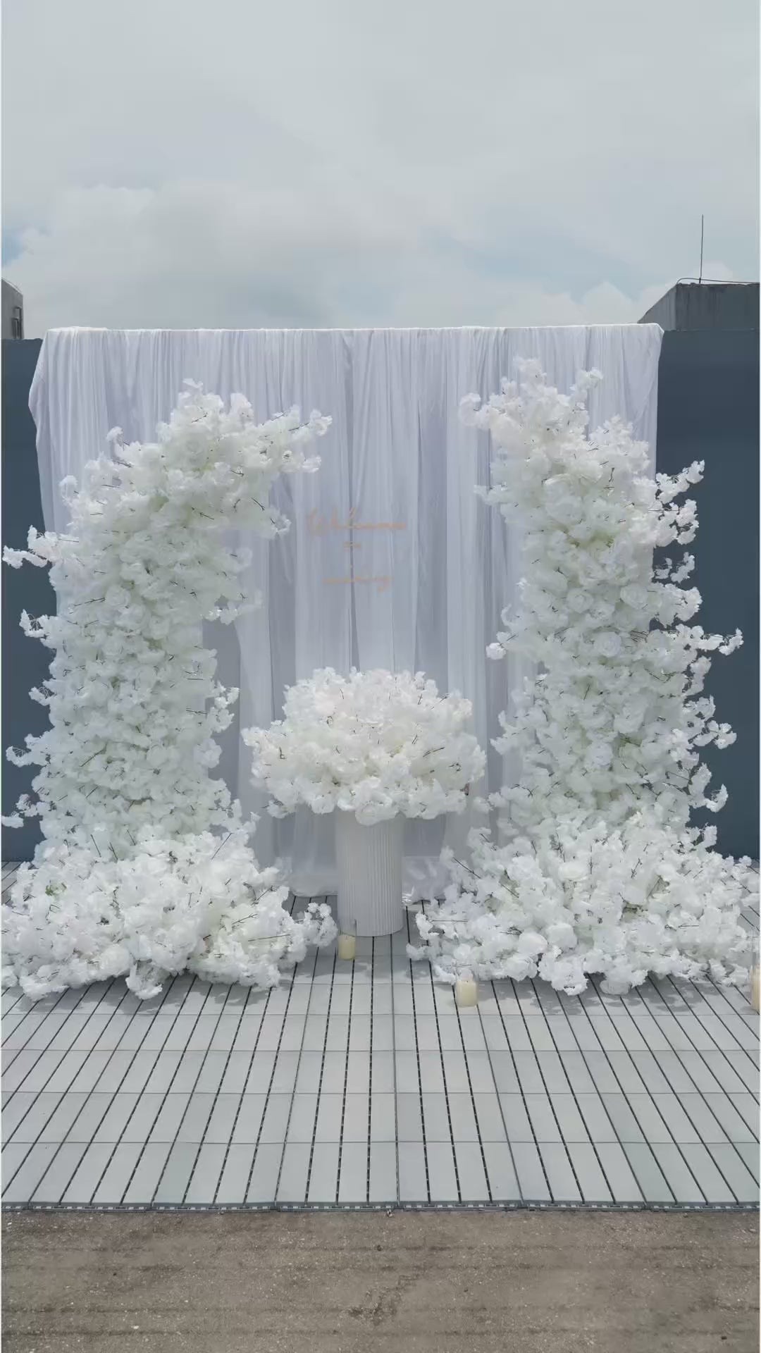cream drape white faux flower proposal backdrop