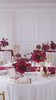 dark_red_floral_arrangement_candle_scene