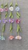 faux‑open‑tulip‑long‑stem‑wood‑background‑shot