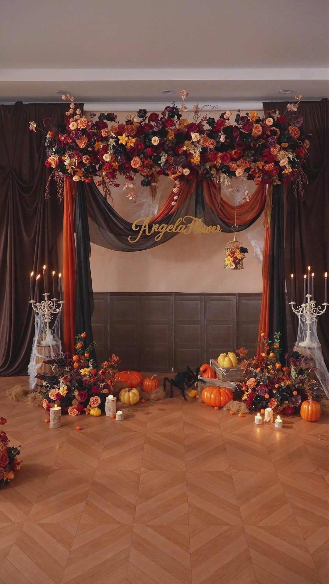 Orange anthurium mixed with black roses halloween arrangement