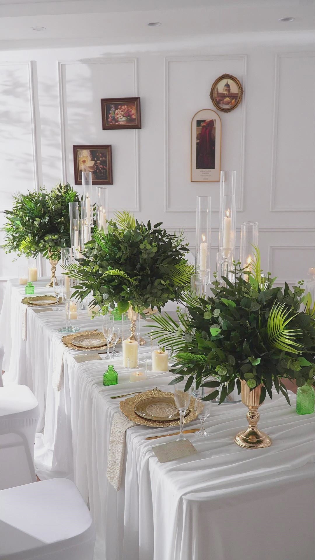 faux eucalyptus and palm frond table greenery for long banquet table