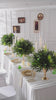 faux eucalyptus and palm frond table greenery for long banquet table