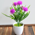 Potted yellow faux flowers with lush green leaves, small tabletop artificial plant decoration